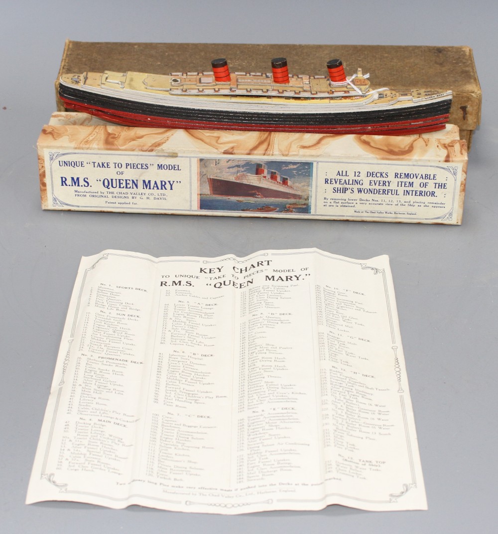 A boxed Chad Valley Unique Take to Pieces model of RMS Queen Mary, together with Keychart, marbled box and outer box,